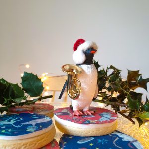 Add a miniature trumpet style instrument...