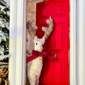 Add a miniature Christmas bell necklace to your animal...