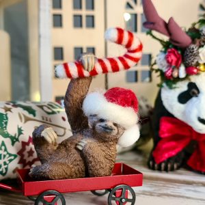 Add a miniature felted candy cane to your festive animals...